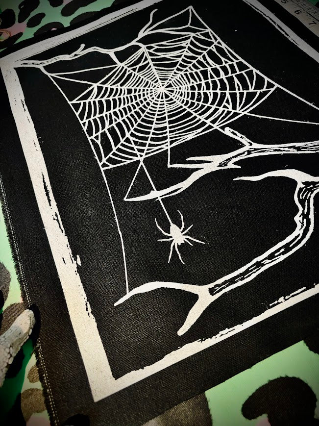 large spider web back patch.