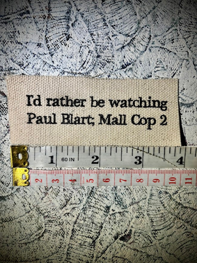 I'd rather be watching Paul Blart Mall Cop 2 sew on patch.