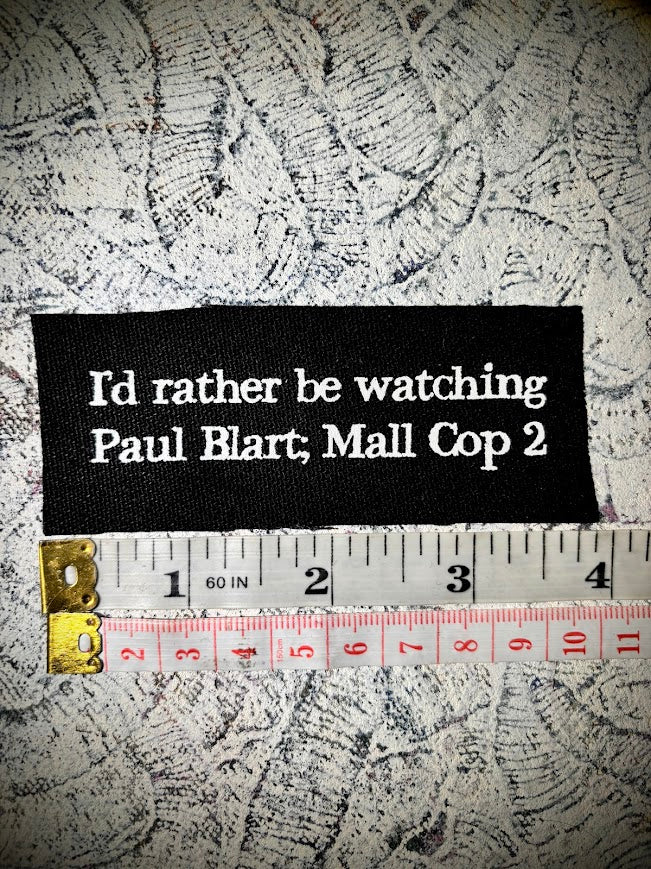 I'd rather be watching Paul Blart Mall Cop 2 sew on patch.