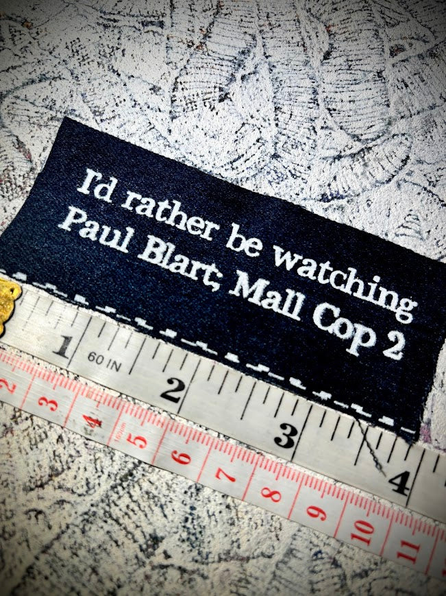 I'd rather be watching Paul Blart Mall Cop 2 sew on patch.