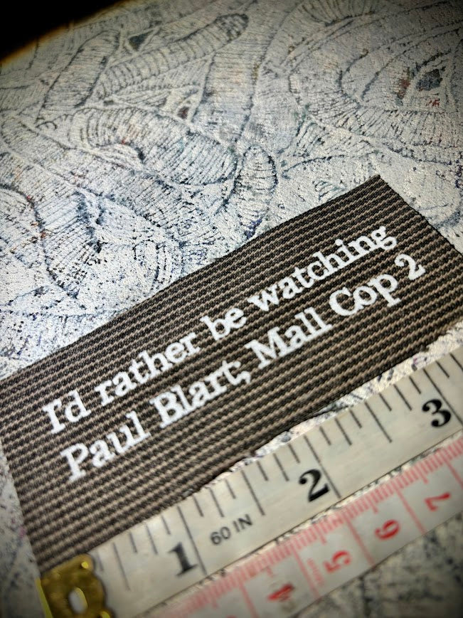 I'd rather be watching Paul Blart Mall Cop 2 sew on patch.