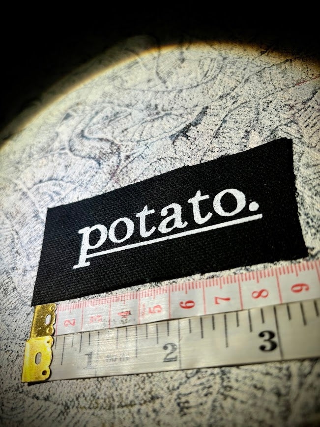 Potato patch. just a tiny patch that says potato.