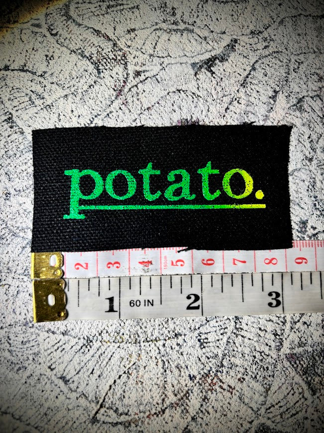 Potato patch. just a tiny patch that says potato.