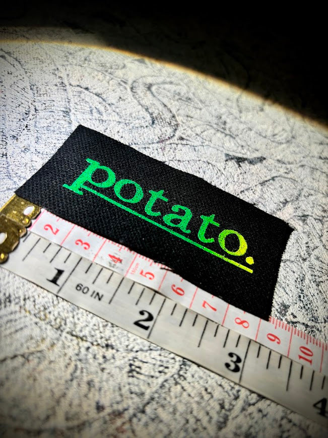 Potato patch. just a tiny patch that says potato.