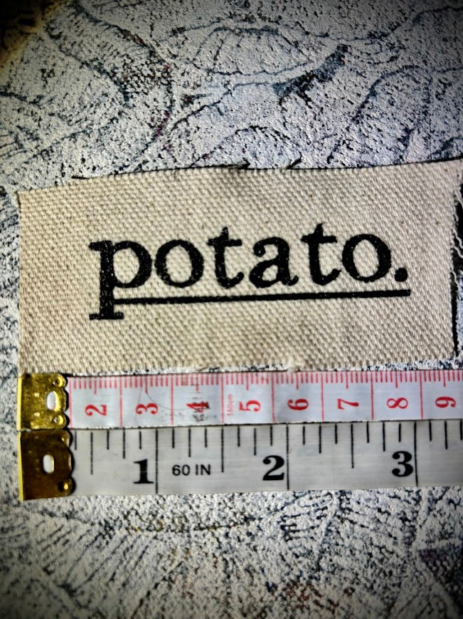 Potato patch. just a tiny patch that says potato.