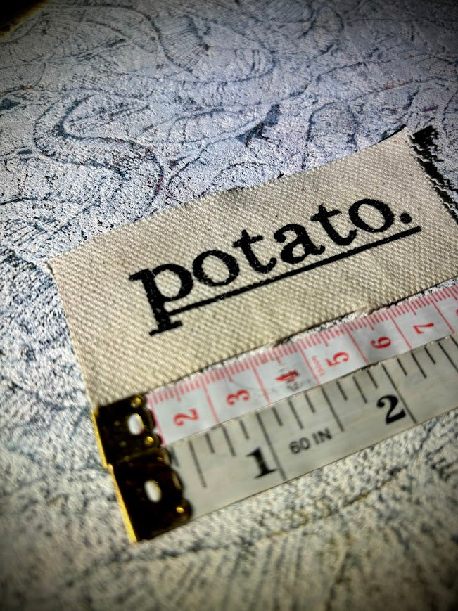 Potato patch. just a tiny patch that says potato.