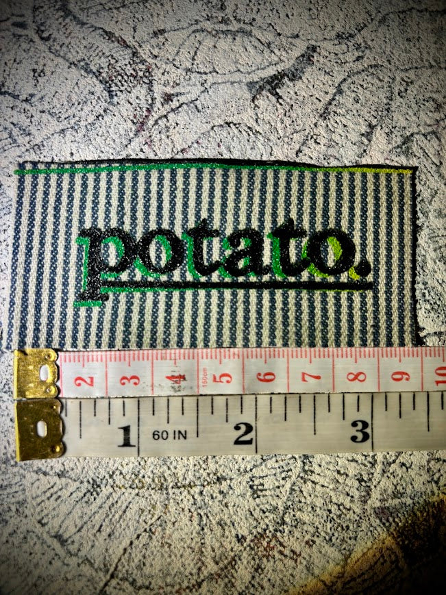 Potato patch. just a tiny patch that says potato.