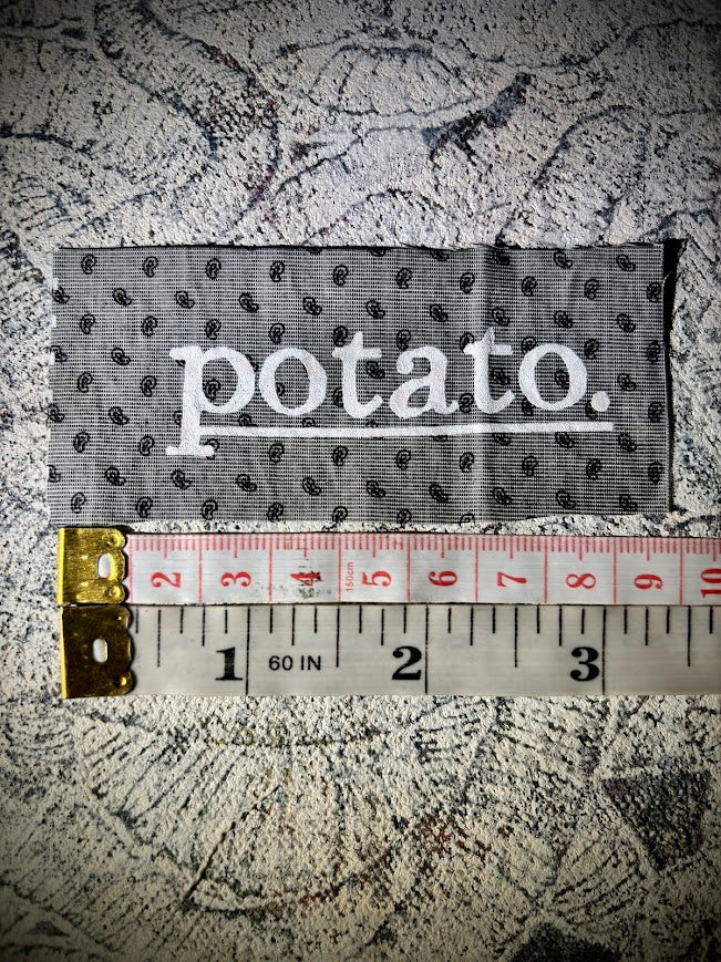 Potato patch. just a tiny patch that says potato.