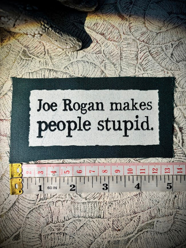 Joe Rogan makes people stupid sew on patch.