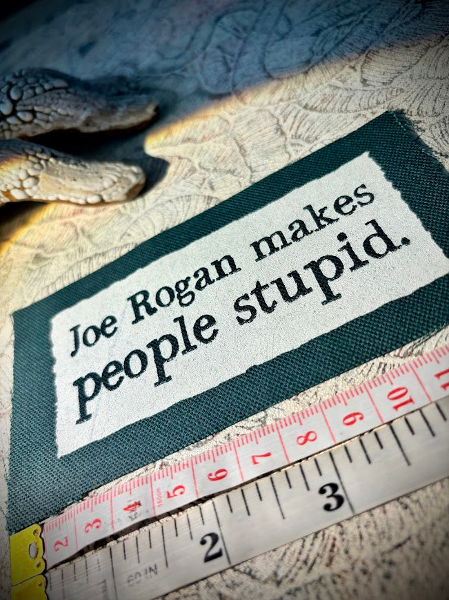 Joe Rogan makes people stupid sew on patch.