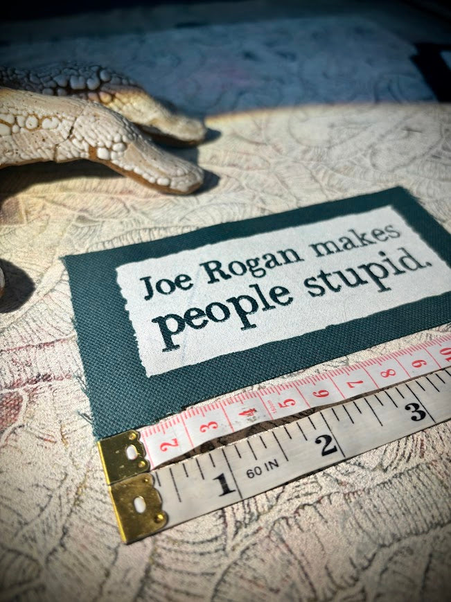 Joe Rogan makes people stupid sew on patch.