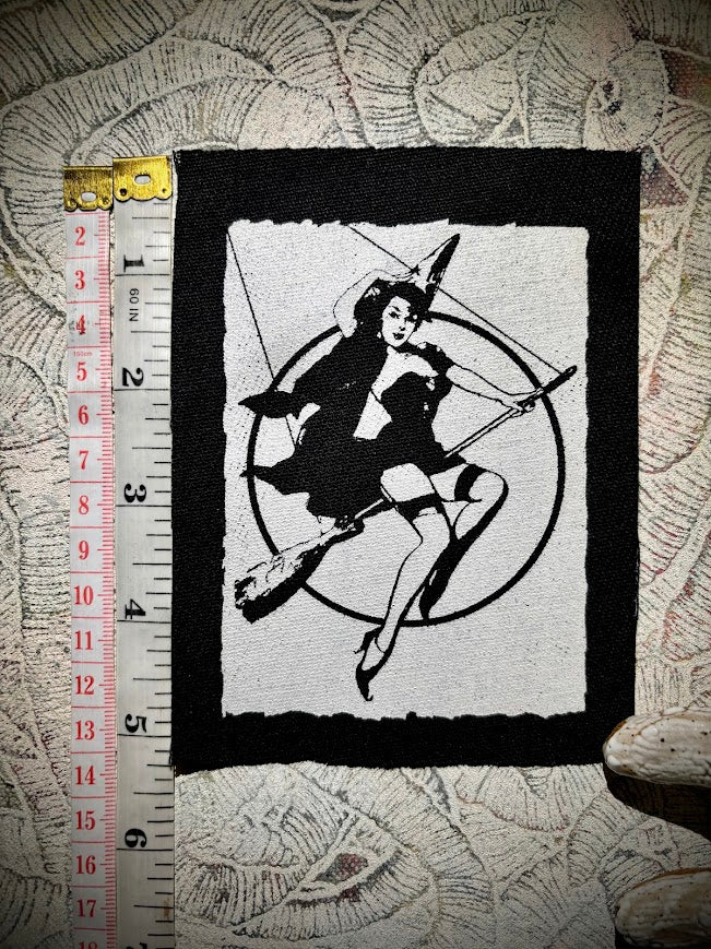 Witch pinup riding a broom sew on patch