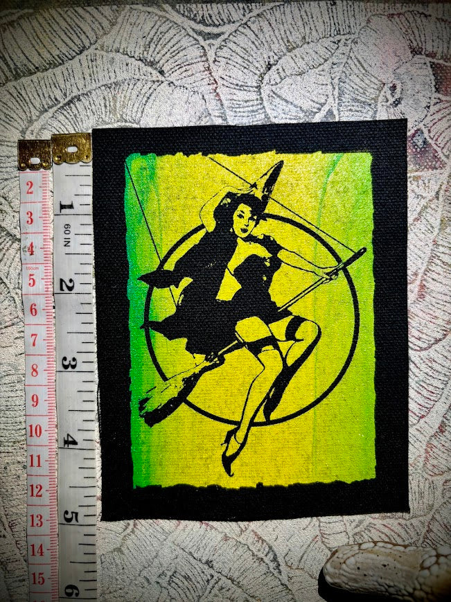 Witch pinup riding a broom sew on patch
