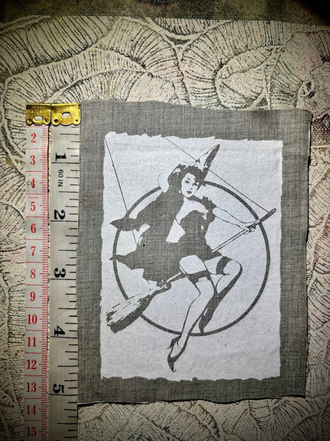 Witch pinup riding a broom sew on patch