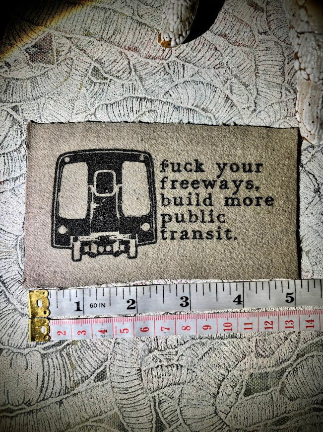 Fuck your freeways, build more public transit sew on patch.
