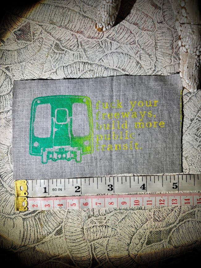 Fuck your freeways, build more public transit sew on patch.