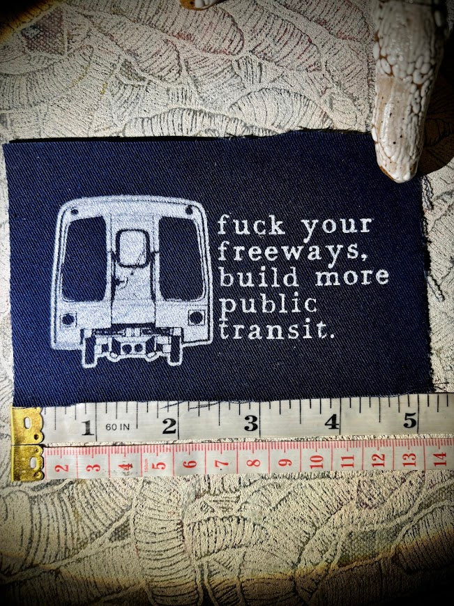 Fuck your freeways, build more public transit sew on patch.