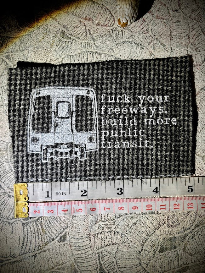 Fuck your freeways, build more public transit sew on patch.