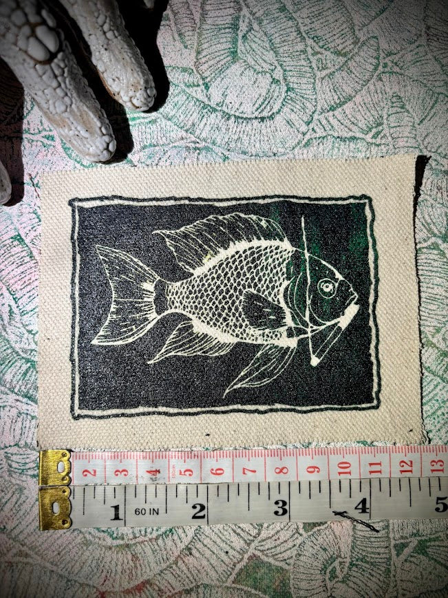 Fish smoking a cigarette patch.
