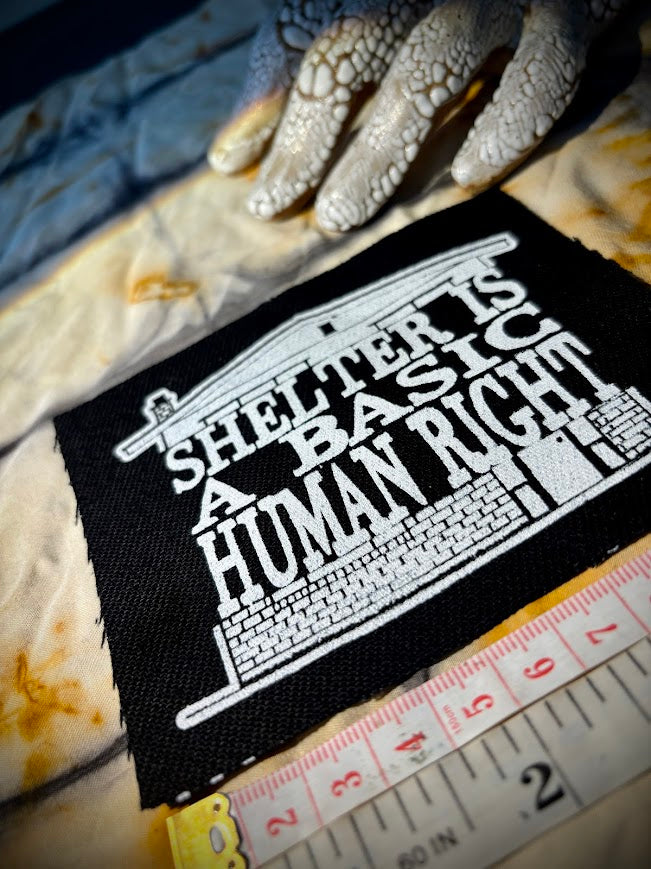 Shelter is a basic human right. sew on patch.