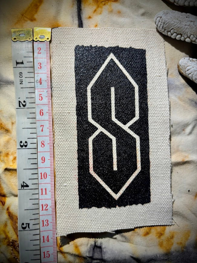 The cool S. that greasy 90's binder S thing sew on patch.