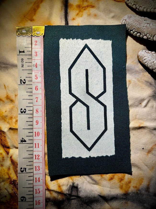 The cool S. that greasy 90's binder S thing sew on patch.