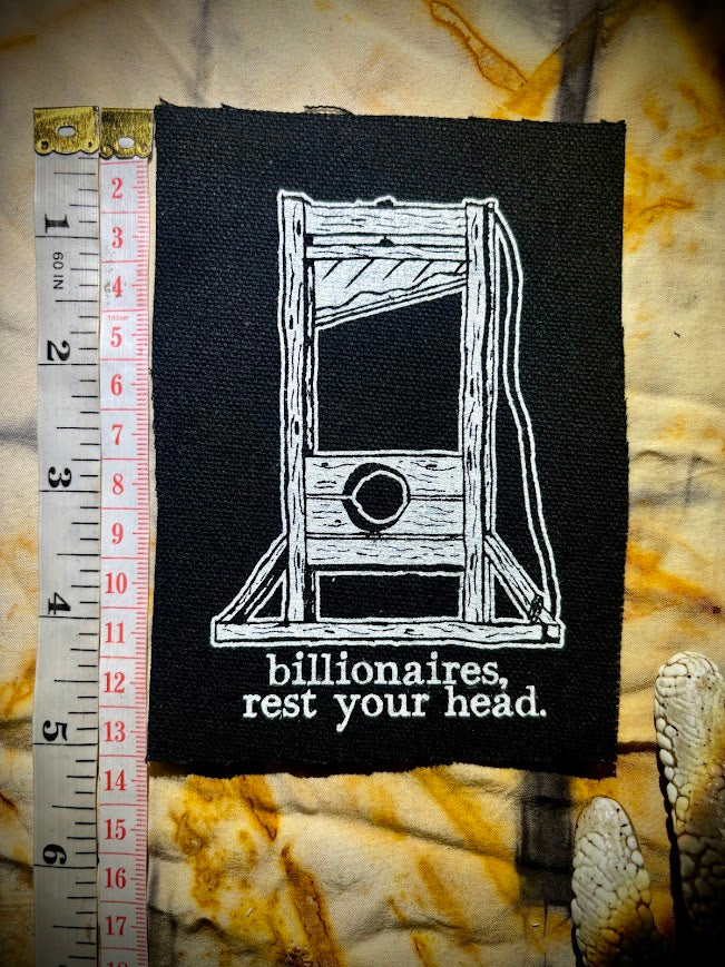 Guillotine sew on patch. Billionaires, rest your head