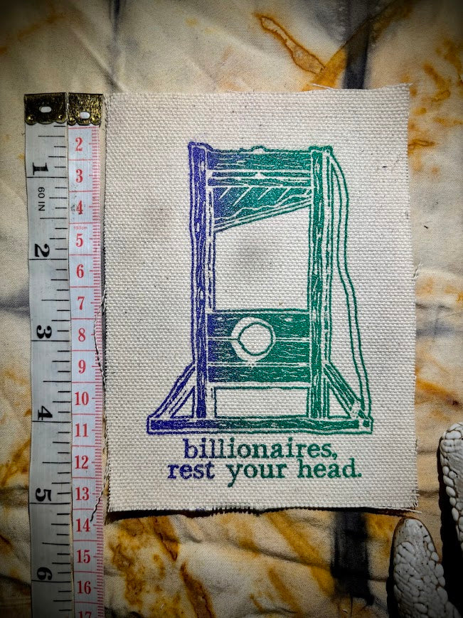 Guillotine sew on patch. Billionaires, rest your head