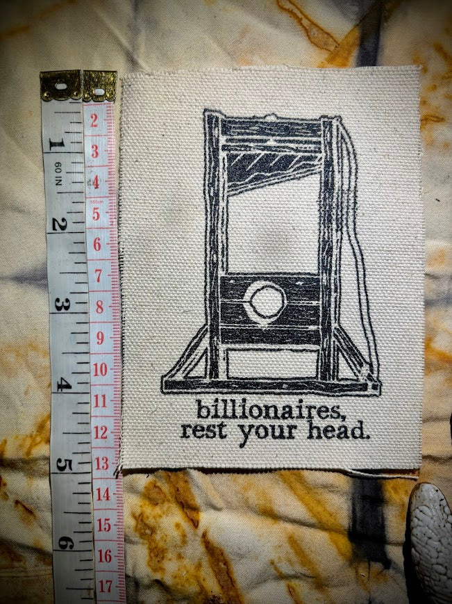 Guillotine sew on patch. Billionaires, rest your head