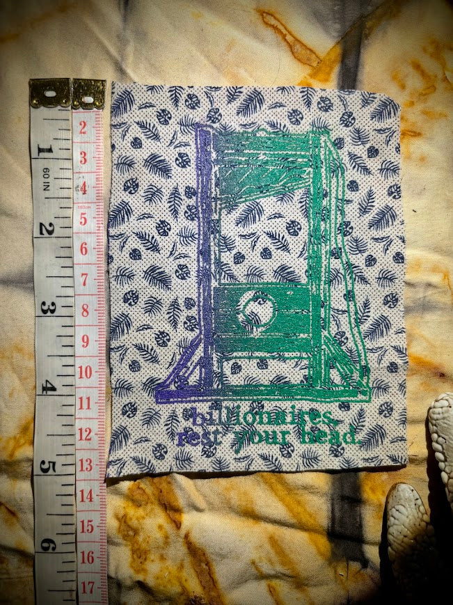 Guillotine sew on patch. Billionaires, rest your head