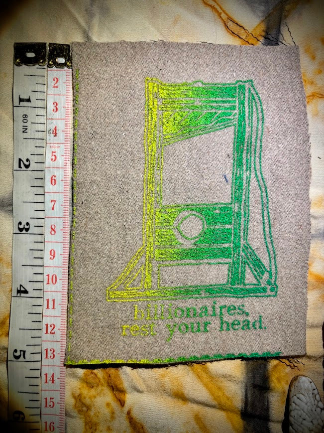Guillotine sew on patch. Billionaires, rest your head