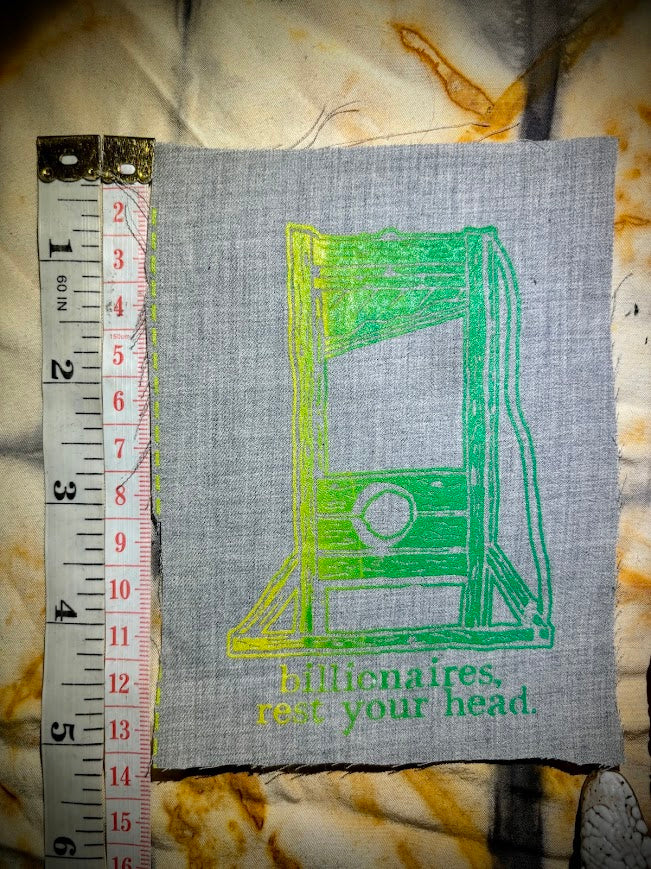 Guillotine sew on patch. Billionaires, rest your head