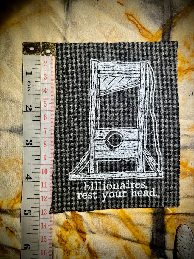 Guillotine sew on patch. Billionaires, rest your head