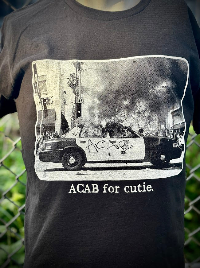 ACAB for Cutie tee. T-shirt with a burning cop car on it