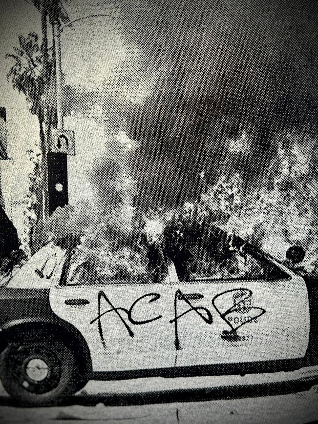 ACAB for Cutie tee. T-shirt with a burning cop car on it