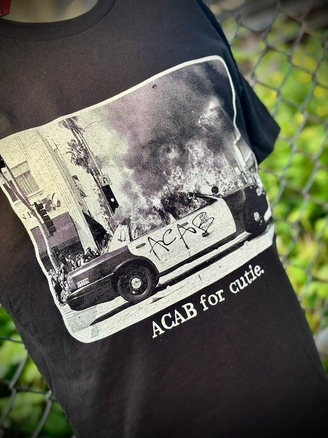 ACAB for Cutie tee. T-shirt with a burning cop car on it