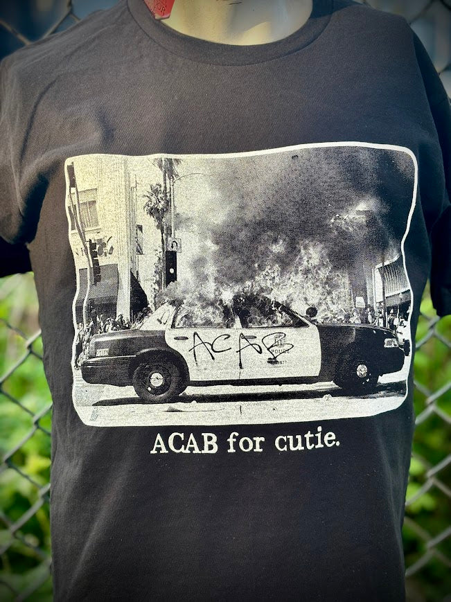 ACAB for Cutie tee. T-shirt with a burning cop car on it