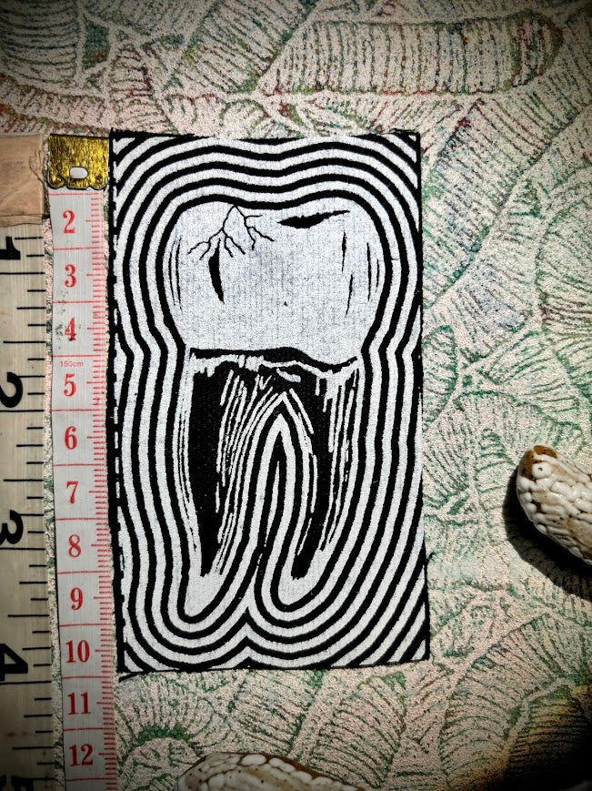 Tooth with a toothache patch