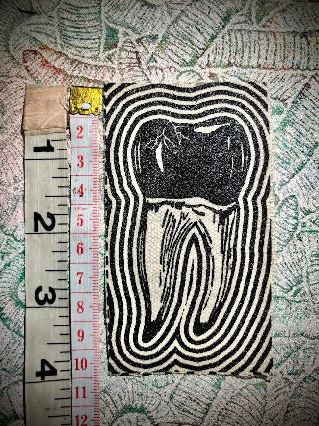 Tooth with a toothache patch