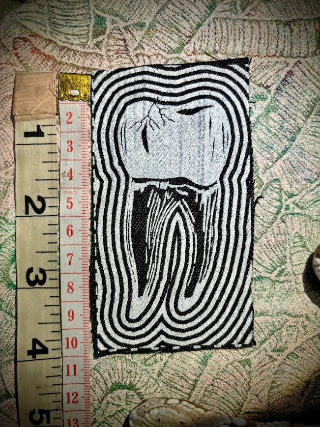Tooth with a toothache patch