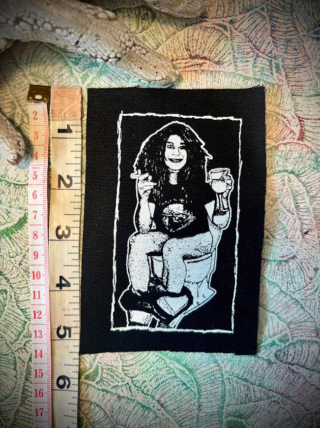 Ozzy Osbourne on the toilet.