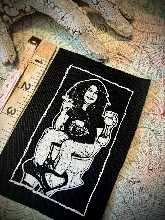 Ozzy Osbourne on the toilet.