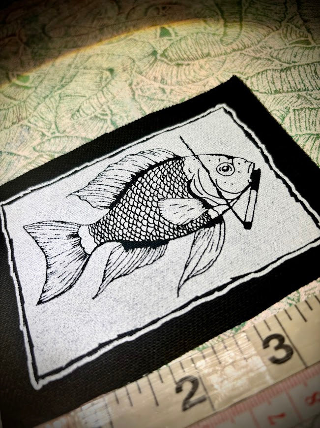Fish smoking a cigarette patch.
