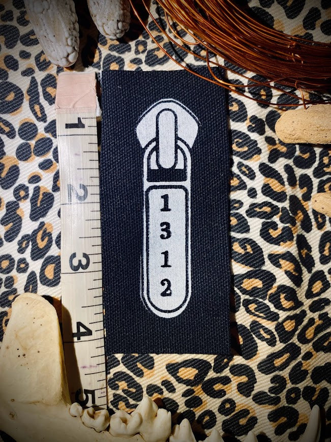 1312 ACAB zipper pull.