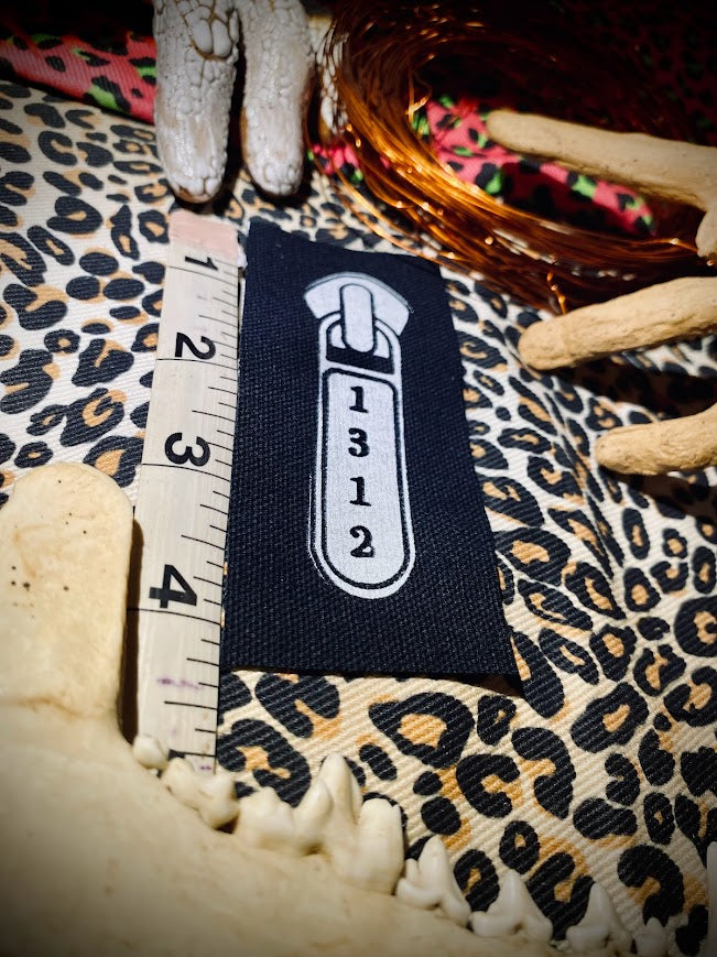 1312 ACAB zipper pull.