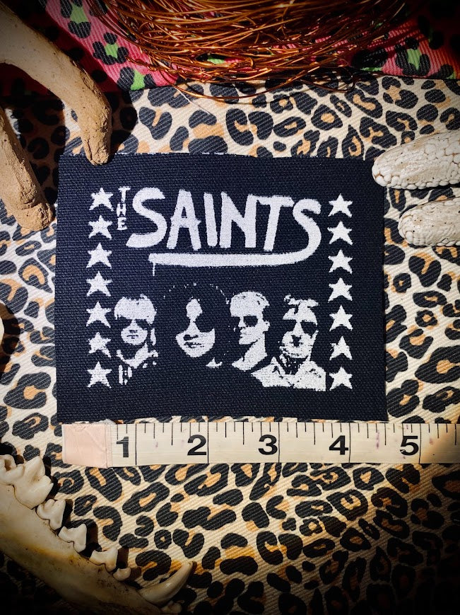 The Saints sew on patch.