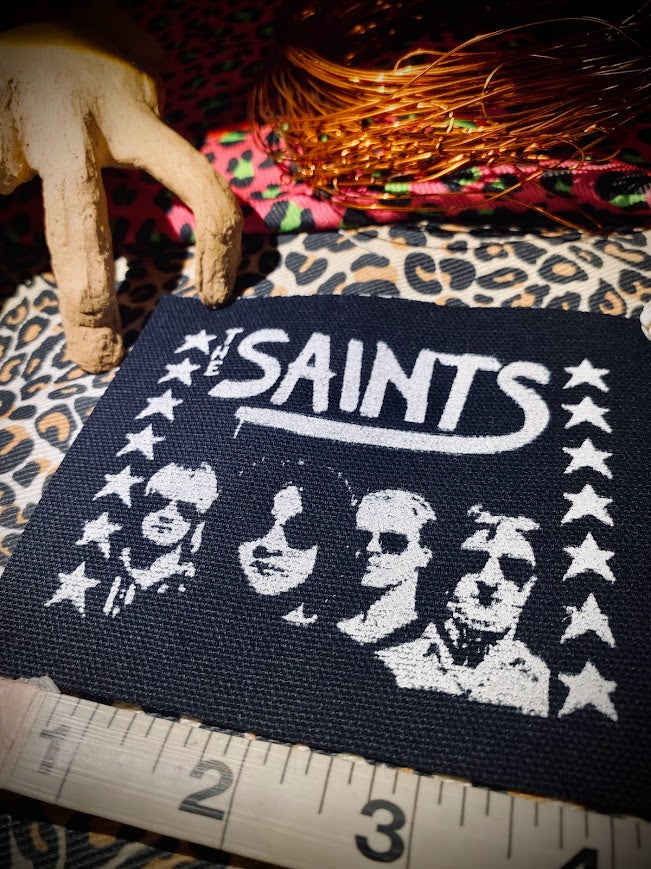 The Saints sew on patch.