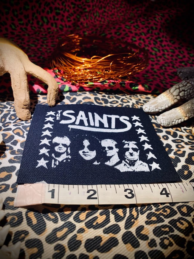The Saints sew on patch.