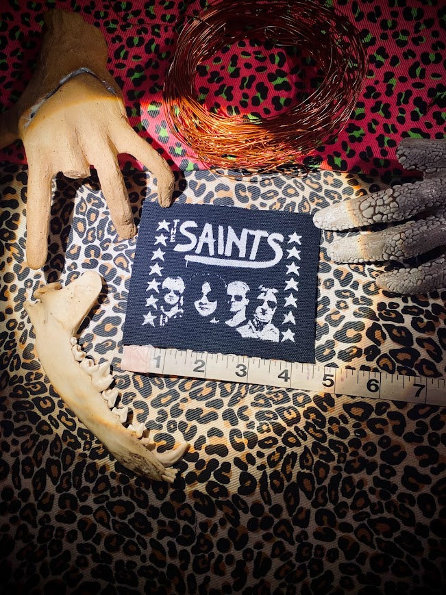 The Saints sew on patch.