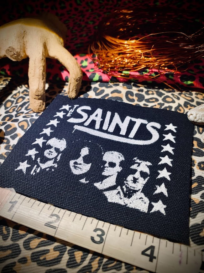 The Saints sew on patch.